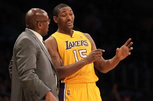 LOS ANGELES, CA - DECEMBER 27:  Metta World Peace #15  and Head coach Mike Brown of the Los Angeles Lakers talk during the game with the Utah Jazz at Staples Center on December 27, 2011 in Los Angeles, California.  The Lakers won 96-71.  NOTE TO USER: User expressly acknowledges and agrees that, by downloading and or using this photograph, User is consenting to the terms and conditions of the Getty Images License Agreement.  (Photo by Stephen Dunn/Getty Images)