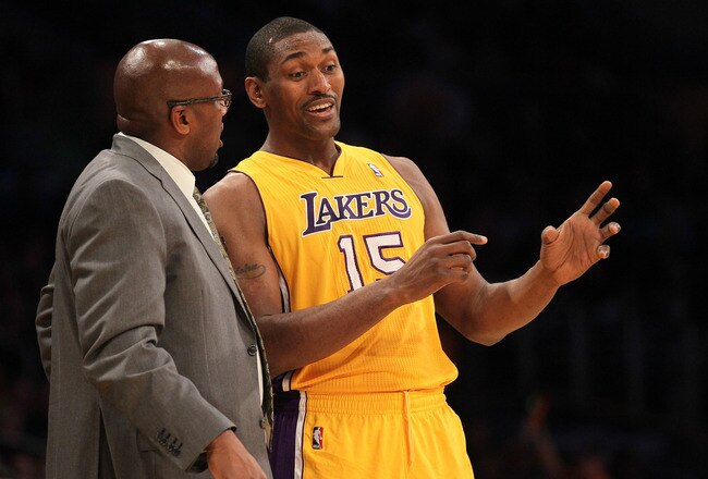 LOS ANGELES, CA - DECEMBER 27:  Metta World Peace #15  and Head coach Mike Brown of the Los Angeles Lakers talk during the game with the Utah Jazz at Staples Center on December 27, 2011 in Los Angeles, California.  The Lakers won 96-71.  NOTE TO USER: User expressly acknowledges and agrees that, by downloading and or using this photograph, User is consenting to the terms and conditions of the Getty Images License Agreement.  (Photo by Stephen Dunn/Getty Images)