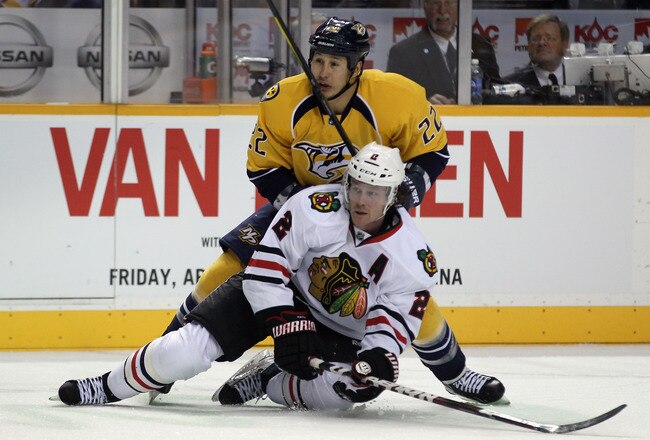 NASHVILLE, TN - FEBRUARY 14:  Jordin Tootoo #22 of the Nashville Predators hits Duncan Keith #2 of the Chicago Blackhawks during the first period at the Bridgestone Arena on February 14, 2012 in Nashville, Tennessee.  (Photo by Bruce Bennett/Getty Images)