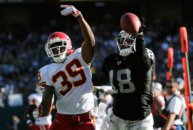 OAKLAND, CA - OCTOBER 23:  Louis Murphy #18 of the Oakland Raiders can't catch up to this pass thrown by Carson Palmer #3 over Brandon Carr #39 of the Kansas City Chiefs at O.co Coliseum on October 23, 2011 in Oakland, California.  (Photo by Thearon W. Henderson/Getty Images)