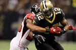 NEW ORLEANS, LA - DECEMBER 26:  Wide receiver Marques Colston #12 of the New Orleans Saints catches the ball against strong safety William Moore #25 of the Atlanta Falcons in the second quarter at the Mercedes-Benz Superdome on December 26, 2011 in New Orleans, Louisiana.  (Photo by Chris Graythen/Getty Images)