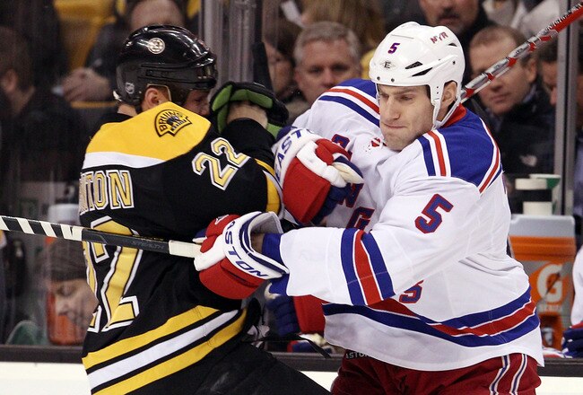 BOSTON, MA - FEBRUARY 14:  Dan Girardi #5 of the New York Rangers and Shawn Thornton #22 of the Boston Bruins shove each other on February 14, 2012 at TD Garden in Boston, Massachusetts.  (Photo by Elsa/Getty Images)