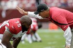 LANDOVER, MD - SEPTEMBER 18: Head coach Ken Whisenhunt of the Arizona Cardinals talks with Levi Brown #75 before the start of their game against the Washington Redskins at FedExField on September 18, 2011 in Landover, Maryland.  (Photo by Rob Carr/Getty Images)