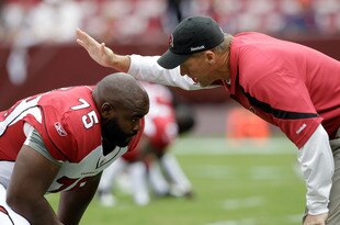 LANDOVER, MD - SEPTEMBER 18: Head coach Ken Whisenhunt of the Arizona Cardinals talks with Levi Brown #75 before the start of their game against the Washington Redskins at FedExField on September 18, 2011 in Landover, Maryland.  (Photo by Rob Carr/Getty Images)
