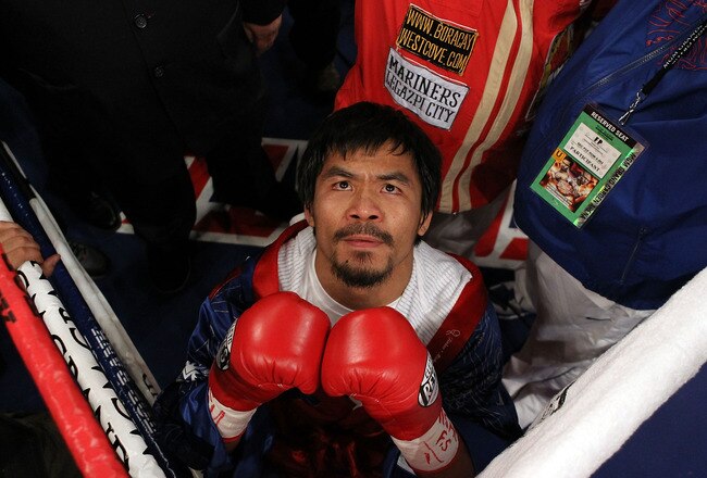 LAS VEGAS - NOVEMBER 14:  Manny Pacquiao prays in the ring before taking on Miguel Cotto during their WBO welterweight title fight at the MGM Grand Garden Arena on November 14, 2009 in Las Vegas, Nevada.  (Photo by Al Bello/Getty Images)