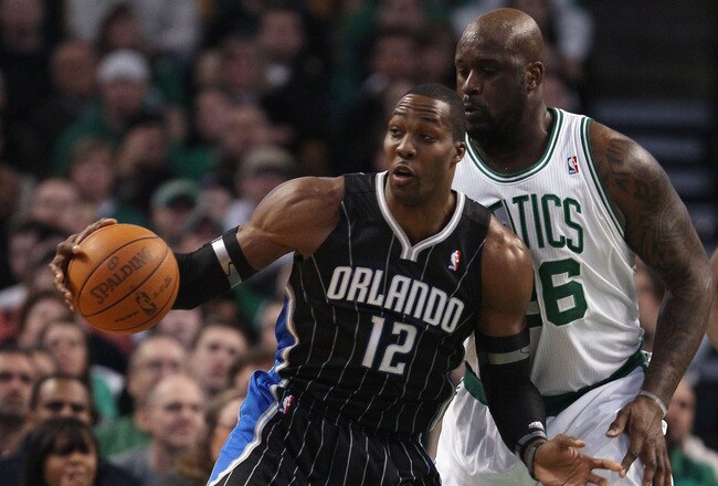 BOSTON, MA - JANUARY 17:  Dwight Howard #12 of the Orlando Magic tries to get around Shaquille O'Neal #36 of the Boston Celtics on January 17, 2011 at the TD Garden in Boston, Massachusetts.  NOTE TO USER: User expressly acknowledges and agrees that, by downloading and/or using this Photograph, User is consenting to the terms and conditions of the Getty Images License Agreement.  (Photo by Elsa/Getty Images)