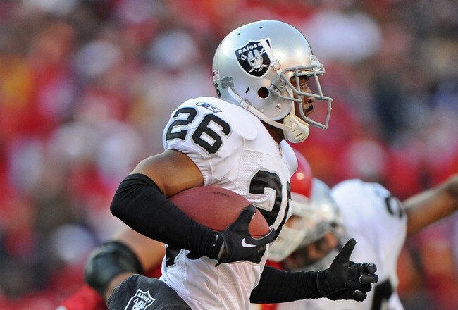 KANSAS CITY, MO - DECEMBER 24:  Defensive back Stanford Routt #26 of the Oakland Raiders returns an interception against the Kansas City Chiefs during the second half on December 24, 2011 at Arrowhead Stadium in Kansas City, Missouri.  Oakland defeated Kansas City 16-13 in overtime.  (Photo by Peter Aiken/Getty Images)