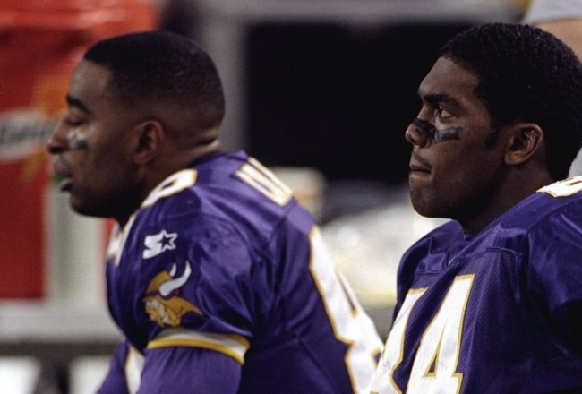 17 Jan 1999:  Randy Moss #84 and Chris Carter #80 of the Minnesota Vikings sitting on the bench during the NFC Championship Game against the Atlanta Falcons at the H. H. H. Metrodome in Minneapolis, Minnesota. The Falcons defeated the Vikings 30-27 in overtime. Mandatory Credit: Jonathan Daniel  /Allsport