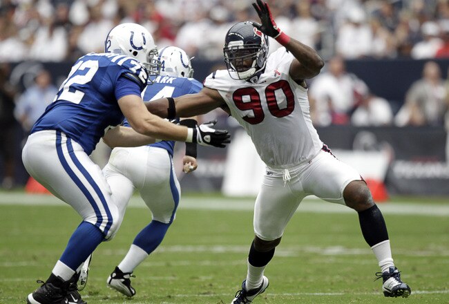 HOUSTON - SEPTEMBER 11:  Mario Williams #90 of the Houston Texans battles with offensive tackle  Jeff Linkenbach #72 of the Indianapolis Colts during the season-opening game at Reliant Stadium on September 11, 2011 in Houston, Texas.  (Photo by Bob Levey/Getty Images)
