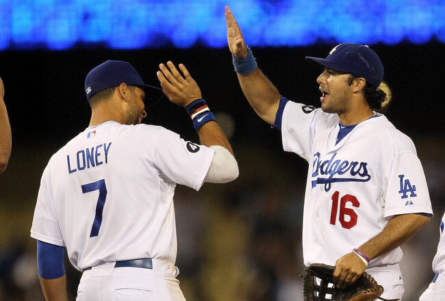 LOS ANGELES, CA - JULY 08:  Andre Ethier #16 and James Loney #7 of the Los Angeles Dodgers celebrate after the game with the San Diego Padres on July 8, 2011 at Dodger Stadium in Los Angeles, California. The Dodgers won 1-0.  (Photo by Stephen Dunn/Getty Images)