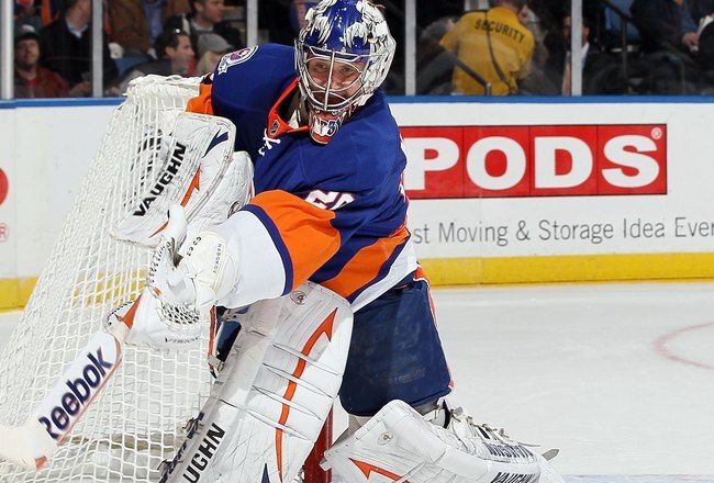 UNIONDALE, NY - FEBRUARY 11:  Evgeni Nabokov #20 of the New York Islanders in action against the Los Angeles Kings on February 11, 2012 at Nassau Coliseum in Uniondale, New York. The Islanders defeated the Kings 2-1 in overtime.  (Photo by Jim McIsaac/Getty Images)