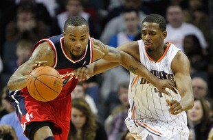 CHARLOTTE, NC - JANUARY 28:  Rashard Lewis #9 of the Washington Wizards and Derrick Brown #4 of the Charlotte Bobcats battle for a ball during their game at Time Warner Cable Arena on January 28, 2012 in Charlotte, North Carolina. NOTE TO USER: User expressly acknowledges and agrees that, by downloading and or using this photograph, User is consenting to the terms and conditions of the Getty Images License Agreement.  (Photo by Streeter Lecka/Getty Images)
