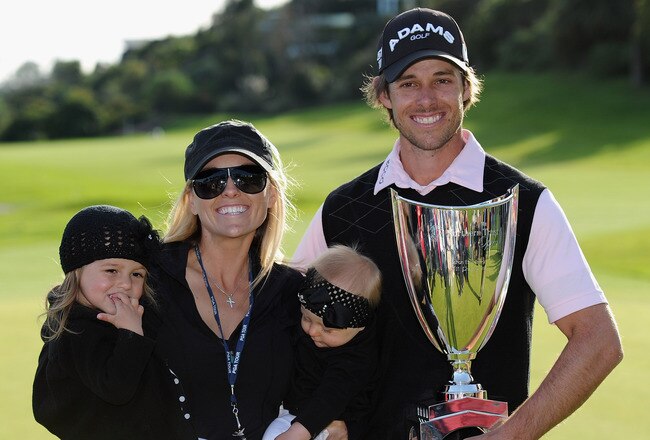 PACIFIC PALISADES, CA - FEBRUARY 20:  Aaron Baddeley of Australia poses his wife Richelle, daughters Jewel and Jolee and the tournament trophy after winning the final round of the Northern Trust Open at Riviera Country Club on February 20, 2011 in Pacific Palisades, California.  (Photo by Stuart Franklin/Getty Images)