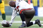 GREEN BAY, WI - NOVEMBER 20:  Albert Haynesworth #95 of the Tampa Bay Buccaneers is injured in the first half against the Green Bay Packers  on November 20,2011 at Lambeau Field in Green Bay, Wisconsin.  (Photo by Elsa/Getty Images)