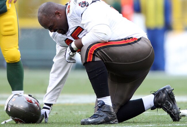 GREEN BAY, WI - NOVEMBER 20:  Albert Haynesworth #95 of the Tampa Bay Buccaneers is injured in the first half against the Green Bay Packers  on November 20,2011 at Lambeau Field in Green Bay, Wisconsin.  (Photo by Elsa/Getty Images)