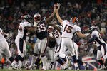 FOXBORO, MA - JANUARY 14:  Brandon Spikes #55 of the New England Patriots pressures Tim Tebow #15 of the Denver Broncos as Tebow throws a pass during their AFC Divisional Playoff Game at Gillette Stadium on January 14, 2012 in Foxboro, Massachusetts.  (Photo by Jim Rogash/Getty Images)