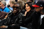 NEW ORLEANS - JANUARY 18:  New Orleans Saints player Reggie Bush sits with Kim Kardashian on the court during the game between the San Antonio Spurs and the New Orleans Hornets at New Orleans Arena on January 18, 2010 in New Orleans, Louisiana.   NOTE TO USER: User expressly acknowledges and agrees that, by downloading and/or using this Photograph, User is consenting to the terms and conditions of the Getty Images License Agreement.  (Photo by Chris Graythen/Getty Images)