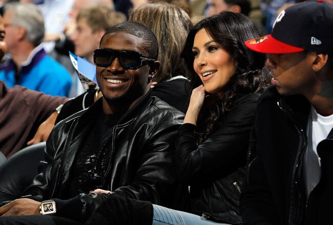 NEW ORLEANS - JANUARY 18:  New Orleans Saints player Reggie Bush sits with Kim Kardashian on the court during the game between the San Antonio Spurs and the New Orleans Hornets at New Orleans Arena on January 18, 2010 in New Orleans, Louisiana.   NOTE TO USER: User expressly acknowledges and agrees that, by downloading and/or using this Photograph, User is consenting to the terms and conditions of the Getty Images License Agreement.  (Photo by Chris Graythen/Getty Images)
