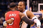 ORLANDO, FL - FEBRUARY 08:  LeBron James #6 of the Miami Heat hugs Dwight Howard #12 of the Orlando Magic during the game at Amway Center on February 8, 2012 in Orlando, Florida.   NOTE TO USER: User expressly acknowledges and agrees that, by downloading and or using this Photograph, user is consenting to the terms and conditions of the Getty Images License Agreement.  (Photo by Sam Greenwood/Getty Images)