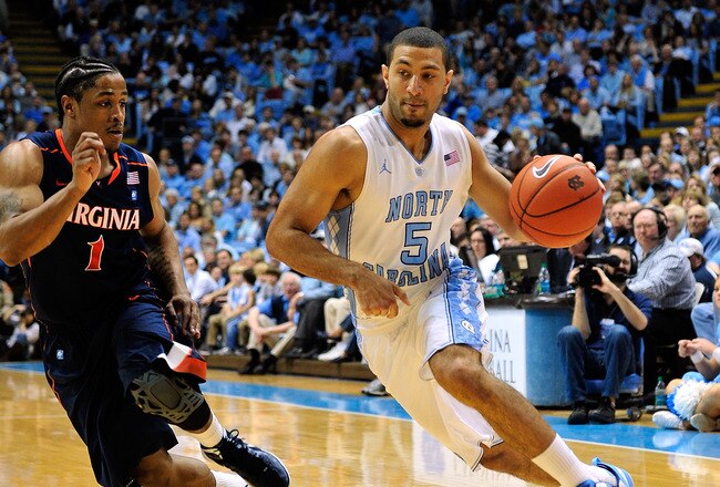 CHAPEL HILL, NC - FEBRUARY 11:  Kendall MArshall #5 of the North Carolina Tar Heels drives against Jontel Evans #1 of the Virginia Cavaliers during play at the Dean Smith Center on February 11, 2012 in Chapel Hill, North Carolina. North Carolina won 70-52.  (Photo by Grant Halverson/Getty Images)