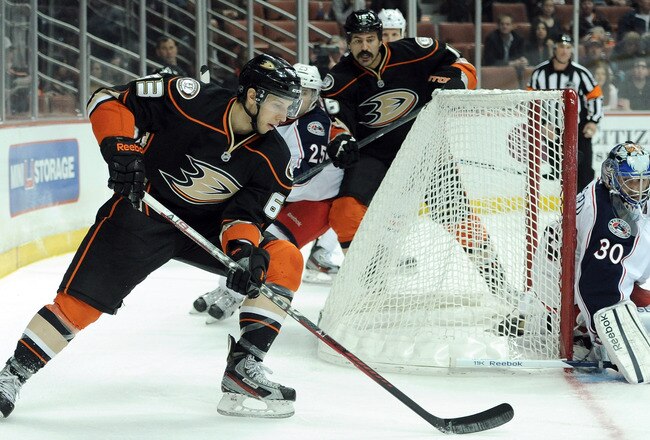 ANAHEIM, CA - FEBRUARY 03:  Jason Blake #33 of the Anaheim Ducks comes from behind the net on Curtis Sanford #30 of the Columbus Blue Jackets during the first period at Honda Center on February 3, 2012 in Anaheim, California.  (Photo by Harry How/Getty Images)