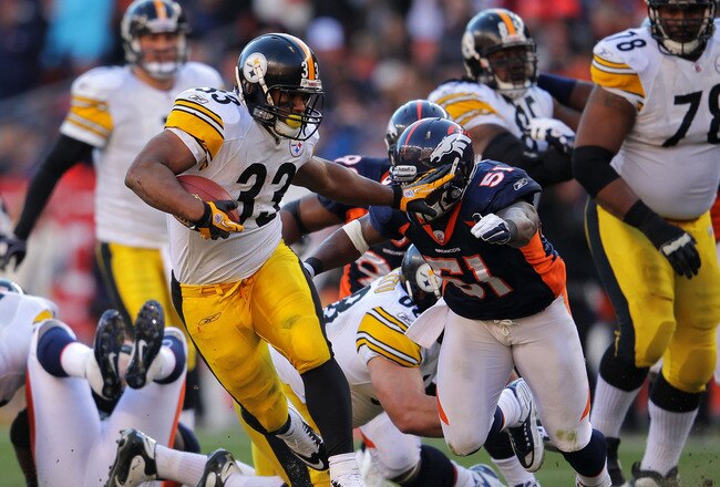 DENVER, CO - JANUARY 08:  Isaac Redman #33 of the Pittsburgh Steelers runs the ball against Joe Mays #51 of the Denver Broncos during the AFC Wild Card Playoff game at Sports Authority Field at Mile High on January 8, 2012 in Denver, Colorado.  (Photo by Doug Pensinger/Getty Images)