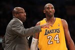 LOS ANGELES, CA - DECEMBER 27:  Kobe Bryant #24 of the Los Angeles Lakers confers with head coach Mike Brown during the game against the Utah Jazz at Staples Center on December 27, 2011 in Los Angeles, California.  The Lakers won 96-71. NOTE TO USER: User expressly acknowledges and agrees that, by downloading and or using this photograph, User is consenting to the terms and conditions of the Getty Images License Agreement.  (Photo by Stephen Dunn/Getty Images)