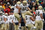 EL PASO, TX - DECEMBER 30:  Safety Harrison Smith #22 celebrates a pass interception with Robert Blanton #12 of the Notre Dame Fighting Irish during play against the Miami Hurricanes at Sun Bowl on December 30, 2010 in El Paso, Texas.  (Photo by Ronald Martinez/Getty Images)