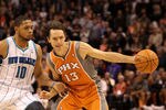 PHOENIX, AZ - DECEMBER 26:  Steve Nash #13 of the Phoenix Suns handles the ball during the season openning NBA game against the New Orleans Hornets at US Airways Center on December 26, 2011 in Phoenix, Arizona.  The Hornets defeated the Suns 85-84. NOTE TO USER: User expressly acknowledges and agrees that, by downloading and or using this photograph, User is consenting to the terms and conditions of the Getty Images License Agreement.  (Photo by Christian Petersen/Getty Images)