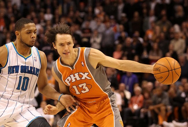 PHOENIX, AZ - DECEMBER 26:  Steve Nash #13 of the Phoenix Suns handles the ball during the season openning NBA game against the New Orleans Hornets at US Airways Center on December 26, 2011 in Phoenix, Arizona.  The Hornets defeated the Suns 85-84. NOTE TO USER: User expressly acknowledges and agrees that, by downloading and or using this photograph, User is consenting to the terms and conditions of the Getty Images License Agreement.  (Photo by Christian Petersen/Getty Images)
