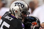 ARLINGTON, TX - SEPTEMBER 04:  Quarterback Ryan Katz #12 of the Oregon State Beavers is tackled by Tanner Brock #35 of the TCU Horned Frogs at Cowboys Stadium on September 4, 2010 in Arlington, Texas.  (Photo by Ronald Martinez/Getty Images)