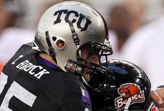 ARLINGTON, TX - SEPTEMBER 04:  Quarterback Ryan Katz #12 of the Oregon State Beavers is tackled by Tanner Brock #35 of the TCU Horned Frogs at Cowboys Stadium on September 4, 2010 in Arlington, Texas.  (Photo by Ronald Martinez/Getty Images)