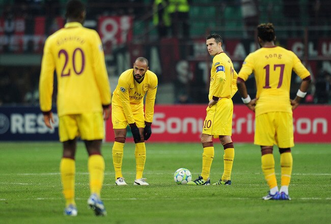 MILAN, ITALY - FEBRUARY 15:  Thierry Henry of Arsenal pulls his socks up after coming on as a substitute during the UEFA Champions League round of 16 first leg match between AC Milan and Arsenal at Stadio Giuseppe Meazza on February 15, 2012 in Milan, Italy.  (Photo by Shaun Botterill/Getty Images)