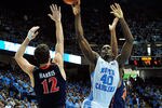 CHAPEL HILL, NC - FEBRUARY 11:  Harrison Barnes #40 of the North Carolina Tar Heels shoots over Joe Harris #12 of the Virginia Cavaliers during play at the Dean Smith Center on February 11, 2012 in Chapel Hill, North Carolina. North Carolina won 70-52.  (Photo by Grant Halverson/Getty Images)