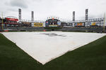 CHICAGO, IL - JUNE 22: A tarp covers the field before the Chicago Cubs take on the Chicago White Sox at U.S. Cellular Field on June 22, 2011 in Chicago, Illinois. The White Sox defeated the Cubs 
4-3. (Photo by Jonathan Daniel/Getty Images)