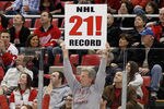 DETROIT, MI - FEBRUARY 14: A fan holds up a sign congratulating the Detroit Red Wings on their NHL record breaking 21st consecutive home victory by beating the Dallas Stars 3-1 at Joe Louis Arena on February 14, 2012 in Detroit, Michigan. (Photo by Gregory Shamus/Getty Images)
