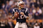 INDIANAPOLIS, IN - FEBRUARY 05:  Quarterback Tom Brady #12 of the New England Patriots looks to pass the ball while taking on the New York Giants during Super Bowl XLVI at Lucas Oil Stadium on February 5, 2012 in Indianapolis, Indiana.  (Photo by Ezra Shaw/Getty Images)