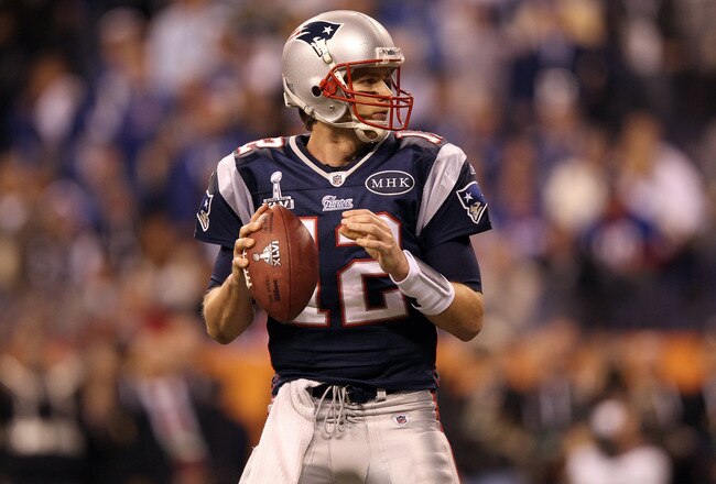 INDIANAPOLIS, IN - FEBRUARY 05:  Quarterback Tom Brady #12 of the New England Patriots looks to pass the ball while taking on the New York Giants during Super Bowl XLVI at Lucas Oil Stadium on February 5, 2012 in Indianapolis, Indiana.  (Photo by Ezra Shaw/Getty Images)