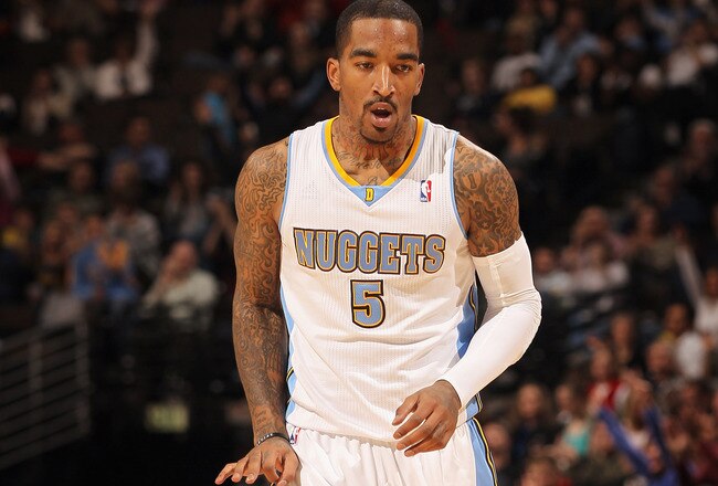 DENVER, CO - FEBRUARY 28:  J.R. Smith #5 of the Denver Nuggets gestures after scoring a three point basket against the Atlanta Hawks during NBA action at the Pepsi Center on February 28, 2011 in Denver, Colorado. The Nuggets deafeated the Hawks 100-90. NOTE TO USER: User expressly acknowledges and agrees that, by downloading and or using this photograph, User is consenting to the terms and conditions of the Getty Images License Agreement.  (Photo by Doug Pensinger/Getty Images)