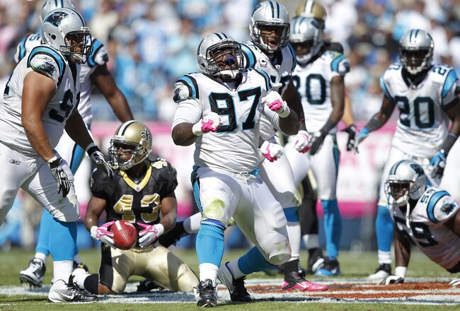 CHARLOTTE, NC - OCTOBER 9: Terrell McClain #97 of the Carolina Panthers celebrates after making a tackle against Darren Sproles #43 of the New Orleans Saints during the first half at Bank of America Stadium on October 9, 2011 in Charlotte, North Carolina. (Photo by Joe Robbins/Getty Images)