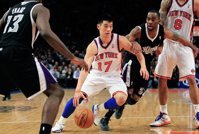 NEW YORK, NY - FEBRUARY 15:  Jeremy Lin #17 of the New York Knicks drives past Marcus Thornton #23 of the Sacramento Kings at Madison Square Garden on February 15, 2012 in New York City. NOTE TO USER: User expressly acknowledges and agrees that, by downloading and/or using this Photograph, user is consenting to the terms and conditions of the Getty Images License Agreement.  (Photo by Chris Trotman/Getty Images)