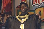 17 Apr 1999: The fifth draft pick Ricky Williams holds his new New Orleans Saints jersey during the NFL Draft at the Madison Square Garden in New York, New York.