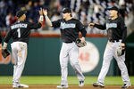 WASHINGTON, DC - SEPTEMBER 16:  Emilio Bonifacio #1, Logan Morrison #20 and Mike Stanton #27 of the Florida Marlins celebrate after a 3-0 victory against the Washington Nationals at Nationals Park on September 16, 2011 in Washington, DC.  (Photo by Greg Fiume/Getty Images)