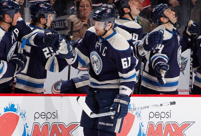 COLUMBUS, OH - JANUARY 14:  Rick Nash #61 of the Columbus Blue Jackets celebrates a third period goal with teammates while playing the San Jose Sharks at Nationwide Arena on January 14, 2012 in Columbus, Ohio. The San Jose Sharks won the game 2-1. (Photo by Gregory Shamus/Getty Images)