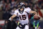 FOXBORO, MA - JANUARY 14:  Tim Tebow #15 of the Denver Broncos throws a pass against the New England Patriots during their AFC Divisional Playoff Game at Gillette Stadium on January 14, 2012 in Foxboro, Massachusetts.  (Photo by Elsa/Getty Images)