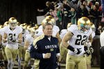 STANFORD, CA - NOVEMBER 26:  Notre Dame Fighting Irish head coach Brian Kelly run on to the field for their game against the Stanford Cardinal at Stanford Stadium on November 26, 2011 in Stanford, California.  (Photo by Ezra Shaw/Getty Images)