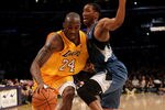 LOS ANGELES - NOVEMBER 9:  Kobe Bryant #24 of the Los Angeles Lakers drives past Wes Johnson #4 of the Minnesota Timberwolves at Staples Center on November 9, 2010 in Los Angeles, California.   NOTE TO USER: User expressly acknowledges and agrees that, by downloading and or using this photograph, User is consenting to the terms and conditions of the Getty Images License Agreement. (Photo by Stephen Dunn/Getty Images)