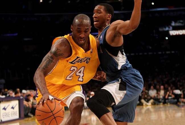 LOS ANGELES - NOVEMBER 9:  Kobe Bryant #24 of the Los Angeles Lakers drives past Wes Johnson #4 of the Minnesota Timberwolves at Staples Center on November 9, 2010 in Los Angeles, California.   NOTE TO USER: User expressly acknowledges and agrees that, by downloading and or using this photograph, User is consenting to the terms and conditions of the Getty Images License Agreement. (Photo by Stephen Dunn/Getty Images)