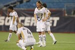 FOXBORO, MA - JULY 14:  Leandro Augusto #7 and Dario Veron #4 of Pumas UNAM react after a loss against the New England Revolution at Gillette Stadium on July 14, 2010 in Foxboro, Massachusetts. The Revolution defeated Puma UNAM 1-0.  (Photo by Elsa/Getty Images)