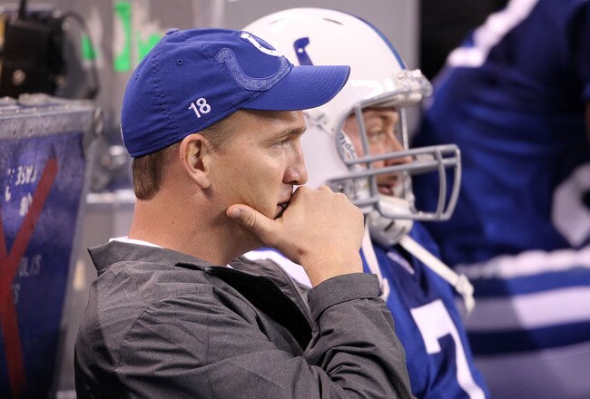 INDIANAPOLIS, IN - NOVEMBER 27:  Peyton Manning and Curtis Painter #7 of the Indianapolis Colts sit on the bench in the final minute of the game against the Carolina Panthers at Lucas Oil Stadium on November 27, 2011 in Indianapolis, Indiana.  The colts lost 27-19.  (Photo by Andy Lyons/Getty Images)